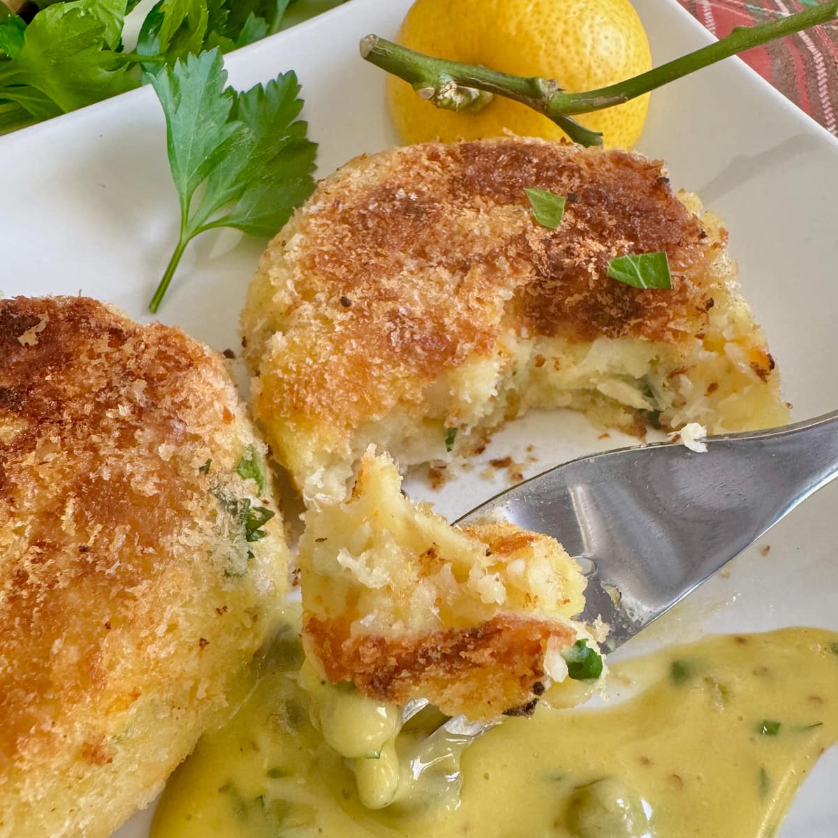 cutting into fluffy smoked haddock and potato fishcakes