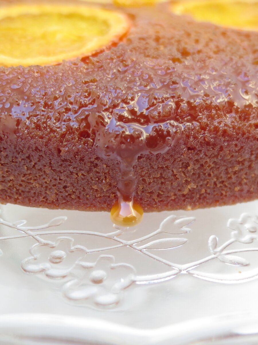sticky orange cake with caramel dribbling on the side