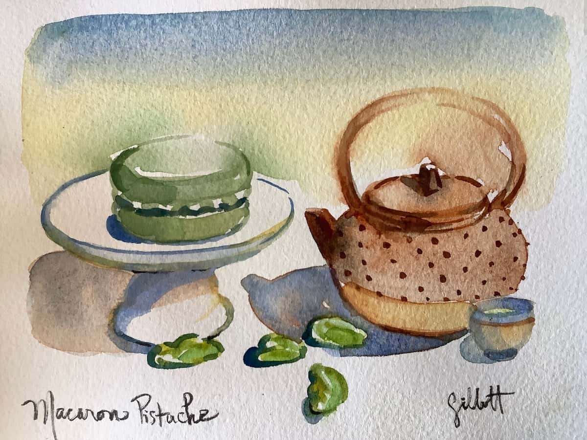 watercolour painting of a macaron and teapot