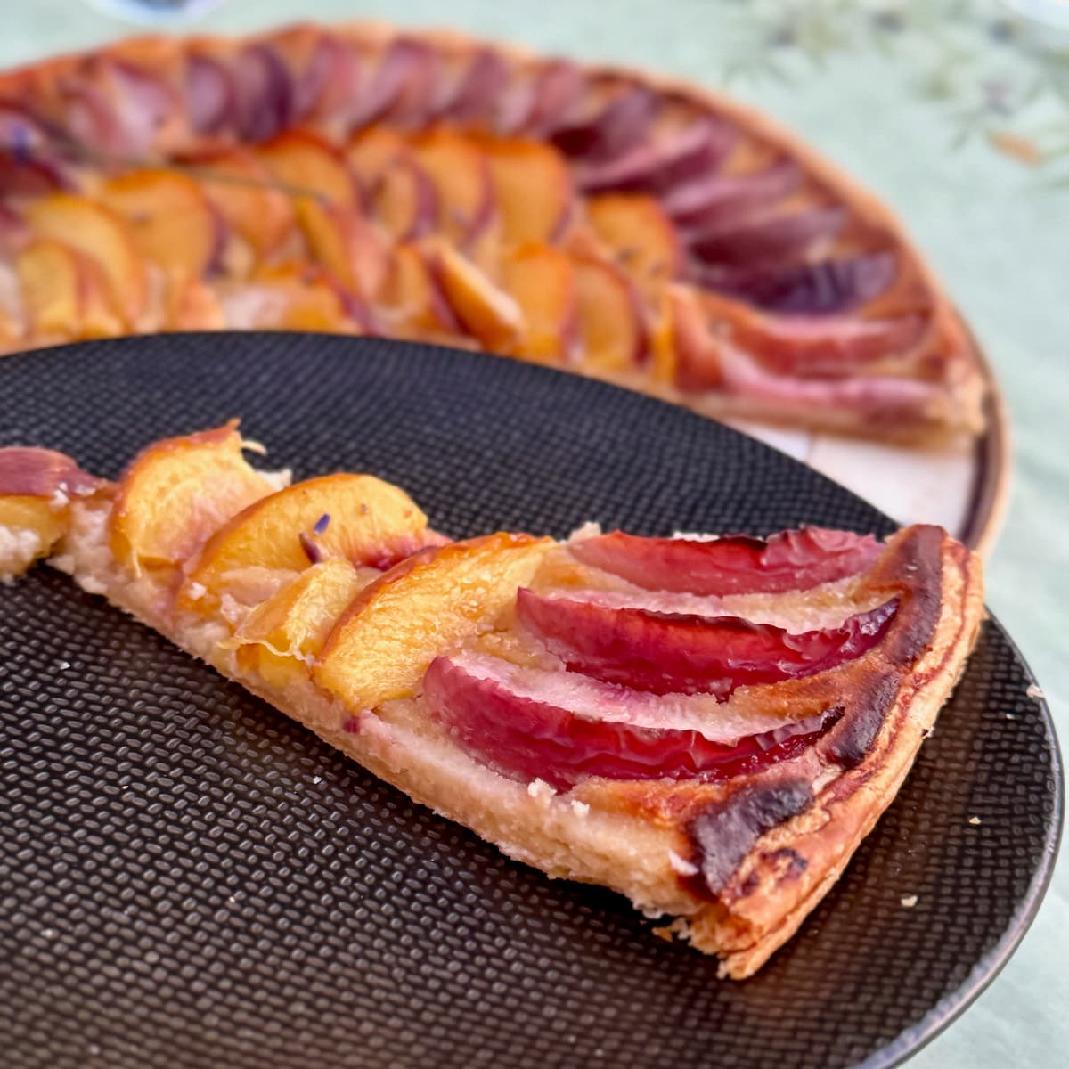 slice of peach and nectarine tart
